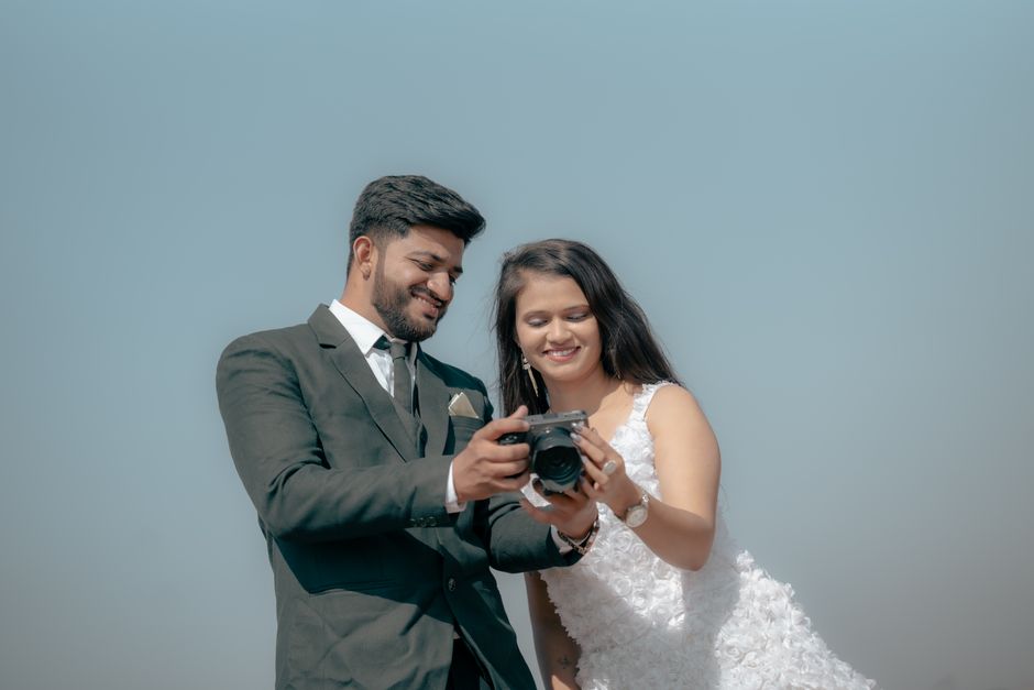 Professional wedding photographer shooting a ceremony